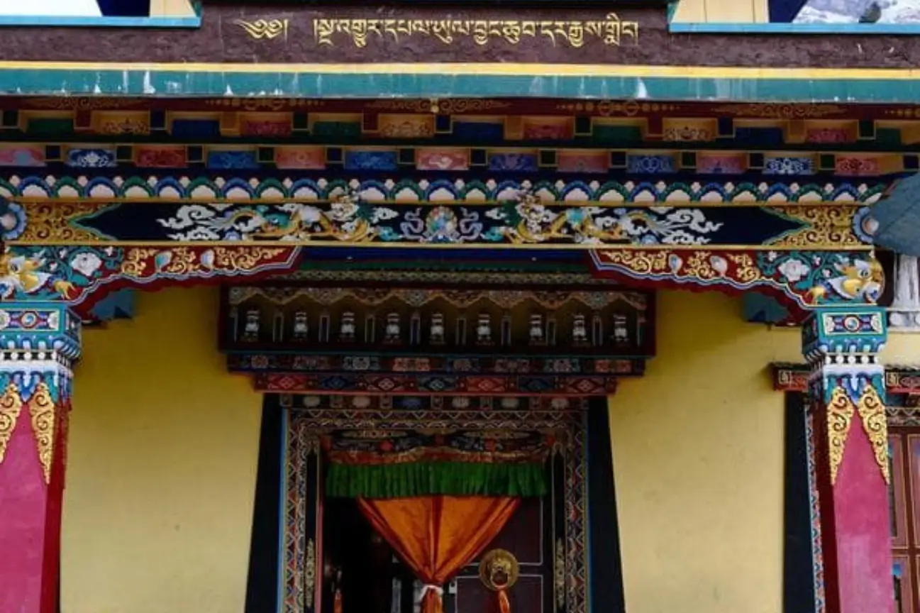 The highly detailed, colorful painted wooden entrance of a Buddhist monastery (gompa) in the remote village of Phu Gaun on the Nar Phu Valley trek.